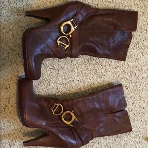 Brown high heeled boots.